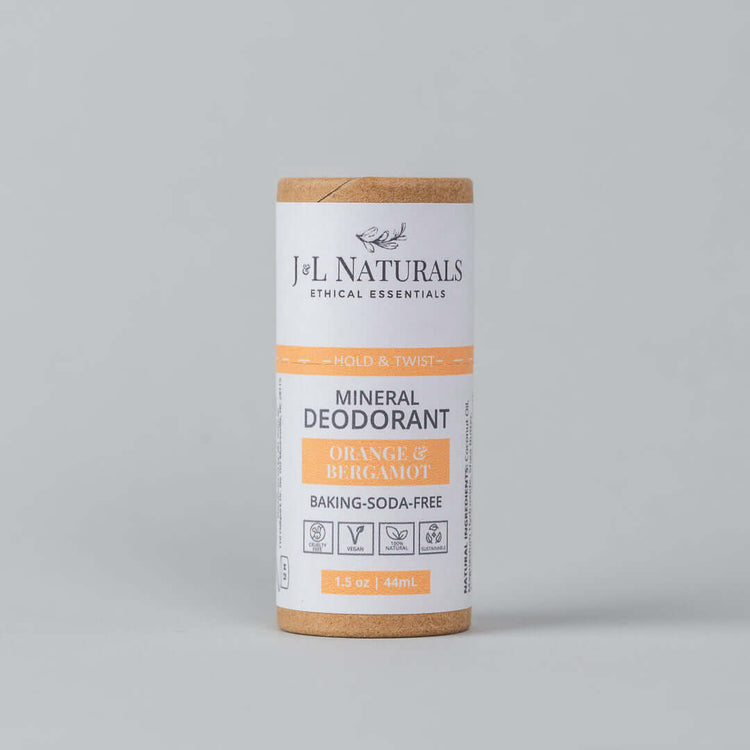 Mineral deodorant stick in orange and bergamot scent, baking soda-free, eco-friendly packaging.