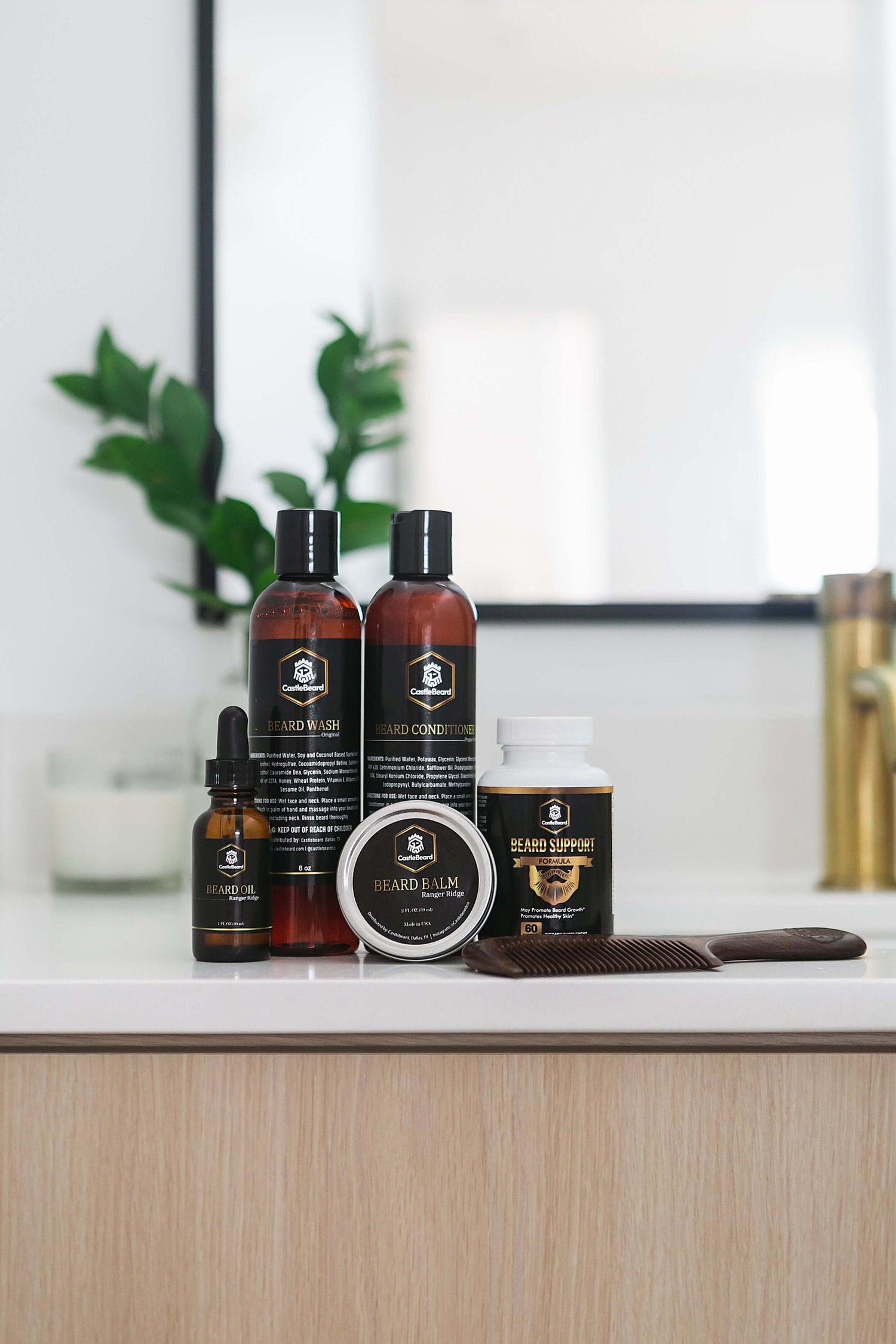 Full Beard Grooming Kit featuring beard oil, balm, wash, conditioner, and accessories on a bathroom countertop.