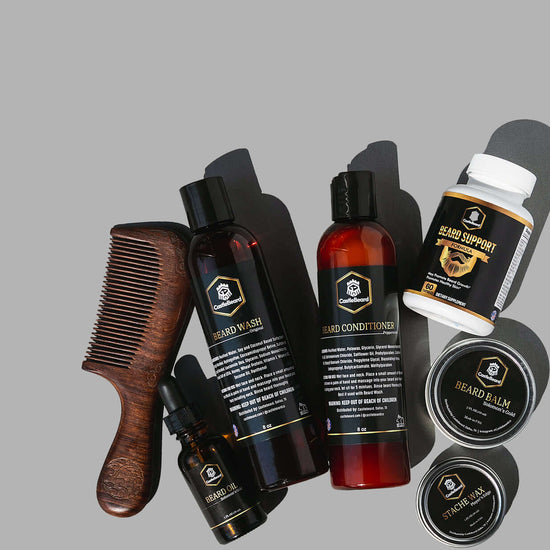 Full Beard Grooming Kit featuring beard oil, balm, wash, conditioner, and comb on grey background.