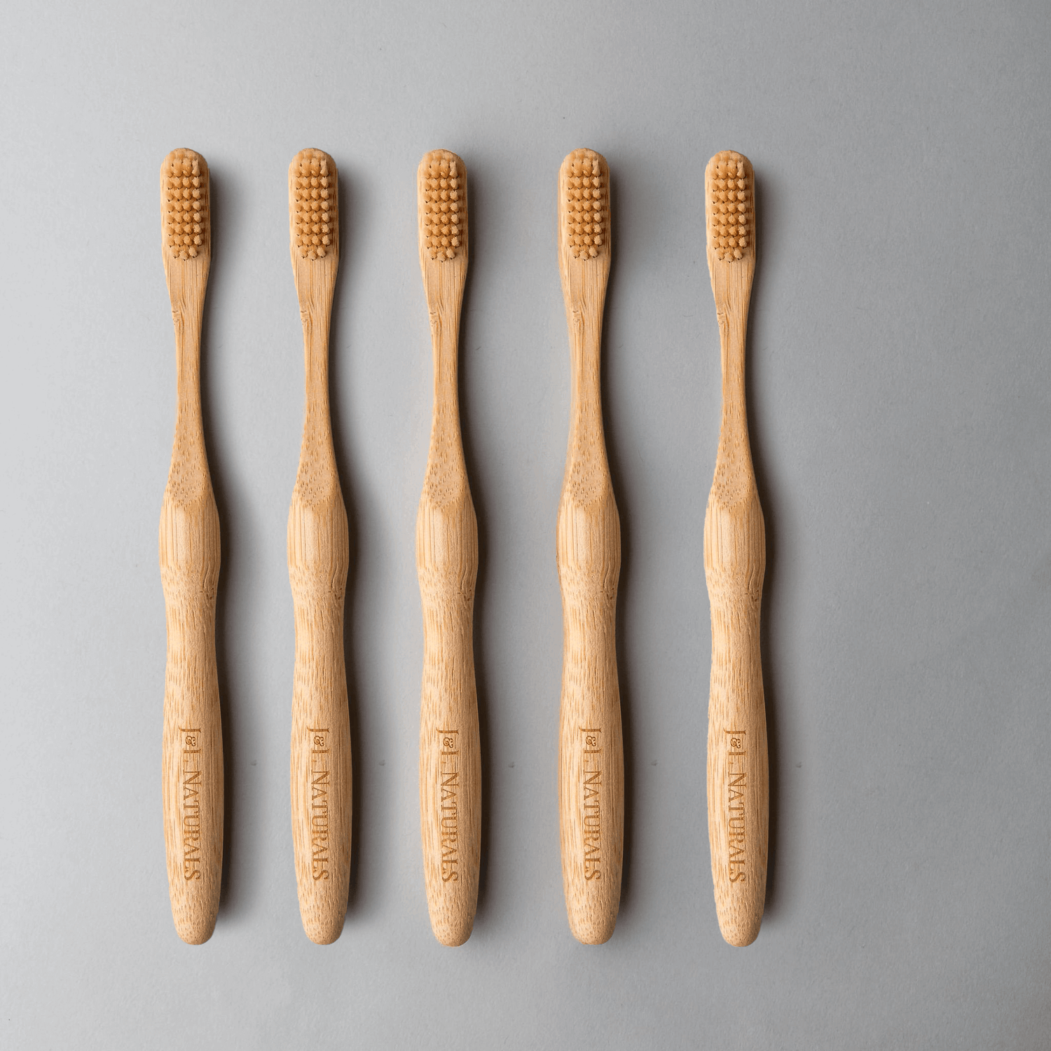 Bamboo Toothbrush Bundle (5-Pack) featuring eco-friendly ergonomic handles and medium wavy bristles.