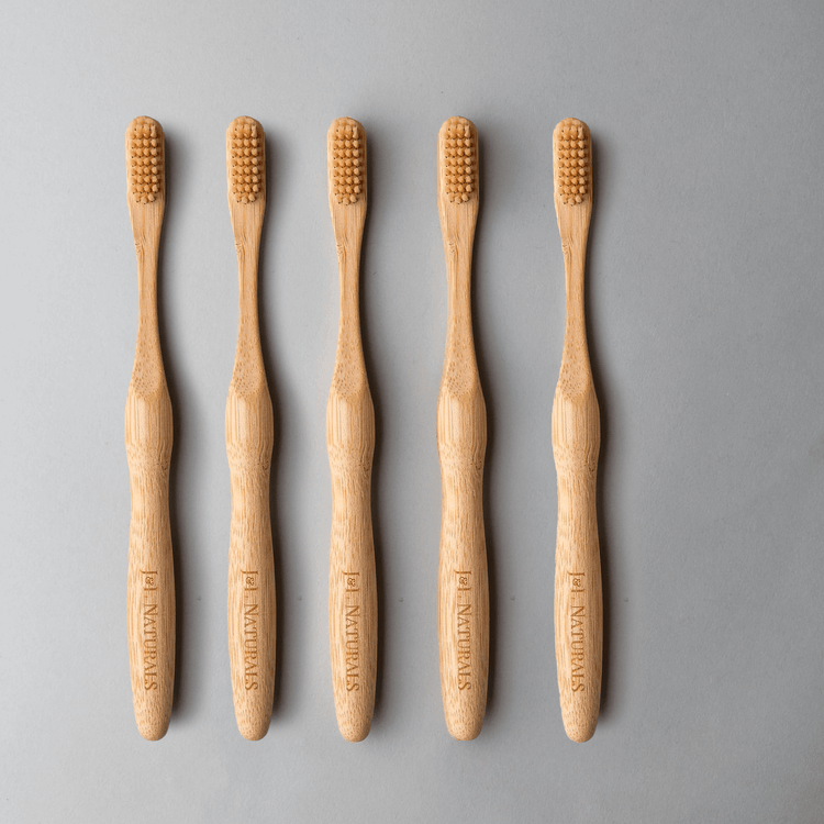 Bamboo Toothbrush Bundle (5-Pack) featuring eco-friendly ergonomic handles and medium wavy bristles.