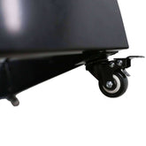 Close-up of a detachable wheel on a black metal planter, highlighting its mobility and design features.