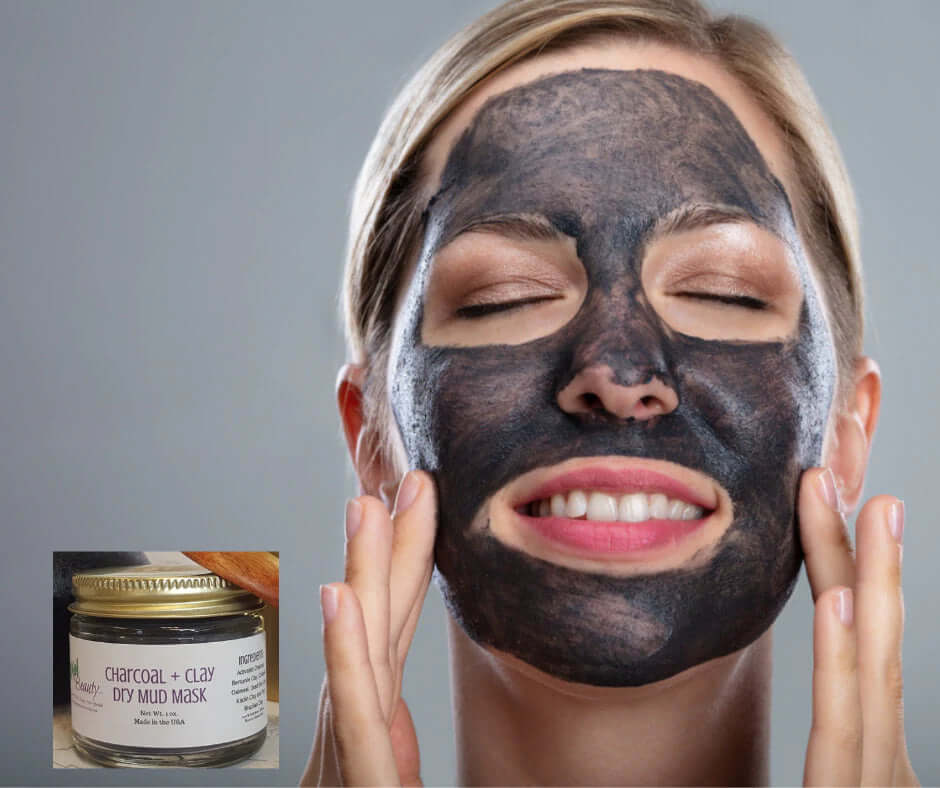 Woman enjoying a charcoal and clay mud mask for natural skincare.