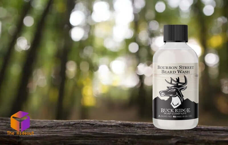 Bourbon Street Natural Beard Wash bottle against a blurred forest background, showcasing organic grooming care.
