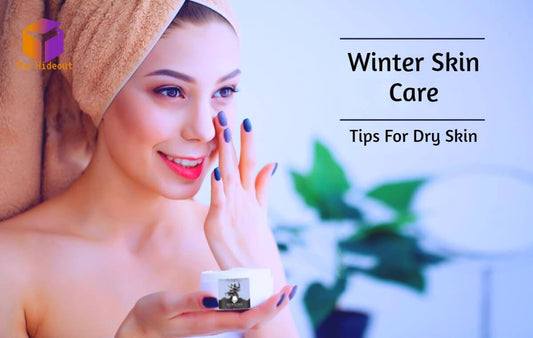 Woman applying cream for winter skin care tips targeting dry skin.