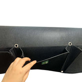 Close-up of a hand holding a Cloth 6 Pocket Saddlebag Planter for vertical gardening, showcasing multiple pockets.