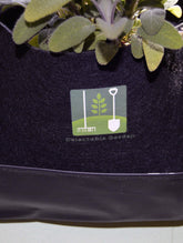 Indoor outdoor waterproof planter with Delectable Garden logo and a green plant, eco-friendly design.