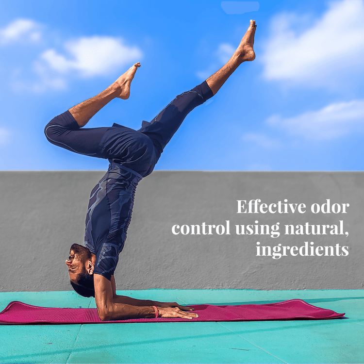 Person doing a yoga pose on a mat outdoors, promoting effective odor control with natural ingredients.