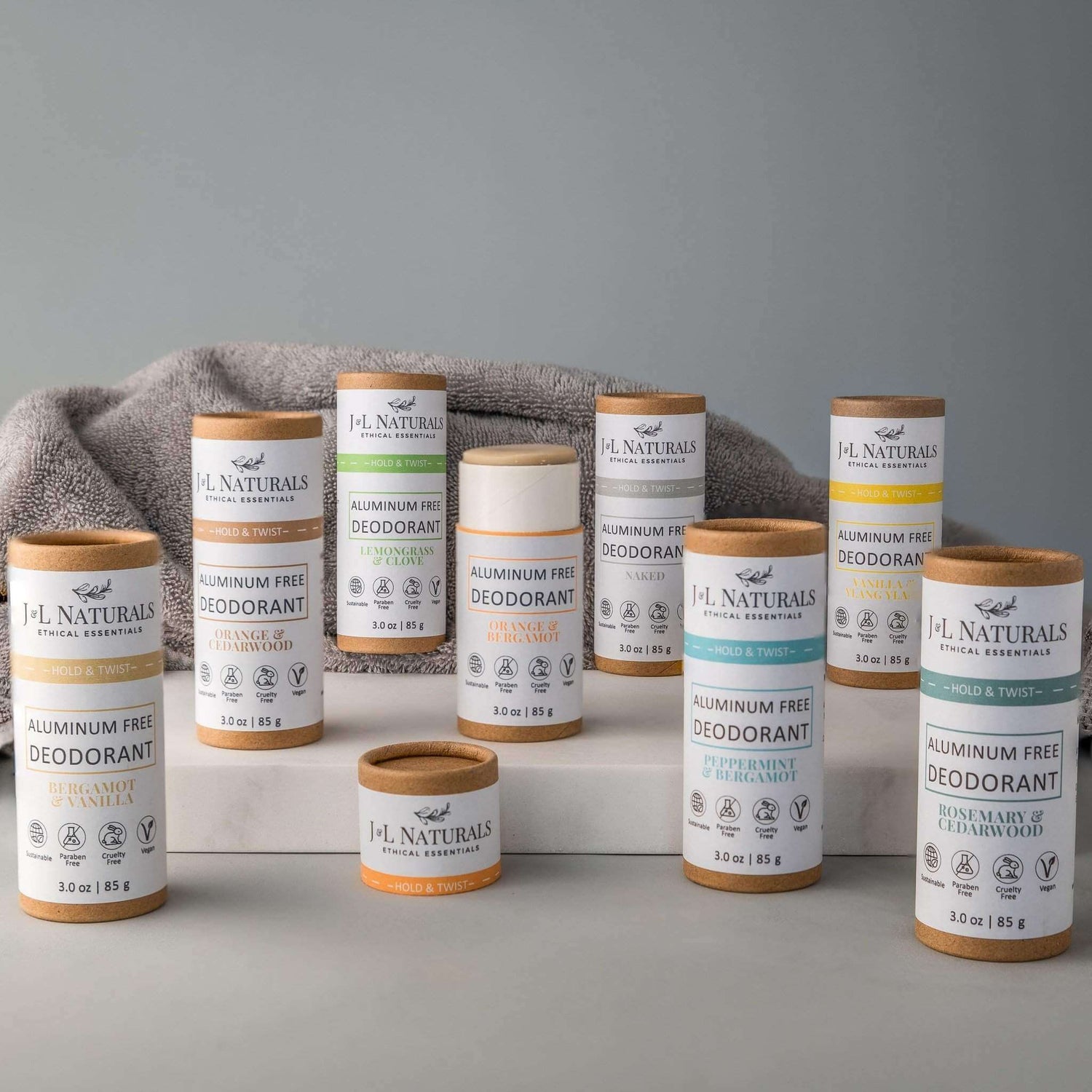 Extra-strength aluminum-free deodorant bundle in various scents, displayed on a soft towel background.