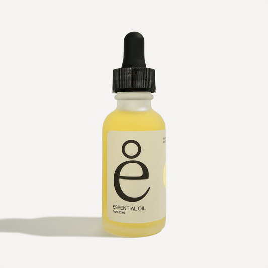 Lemon Essential Oil in a glass dropper bottle, showcasing its refreshing and uplifting properties.