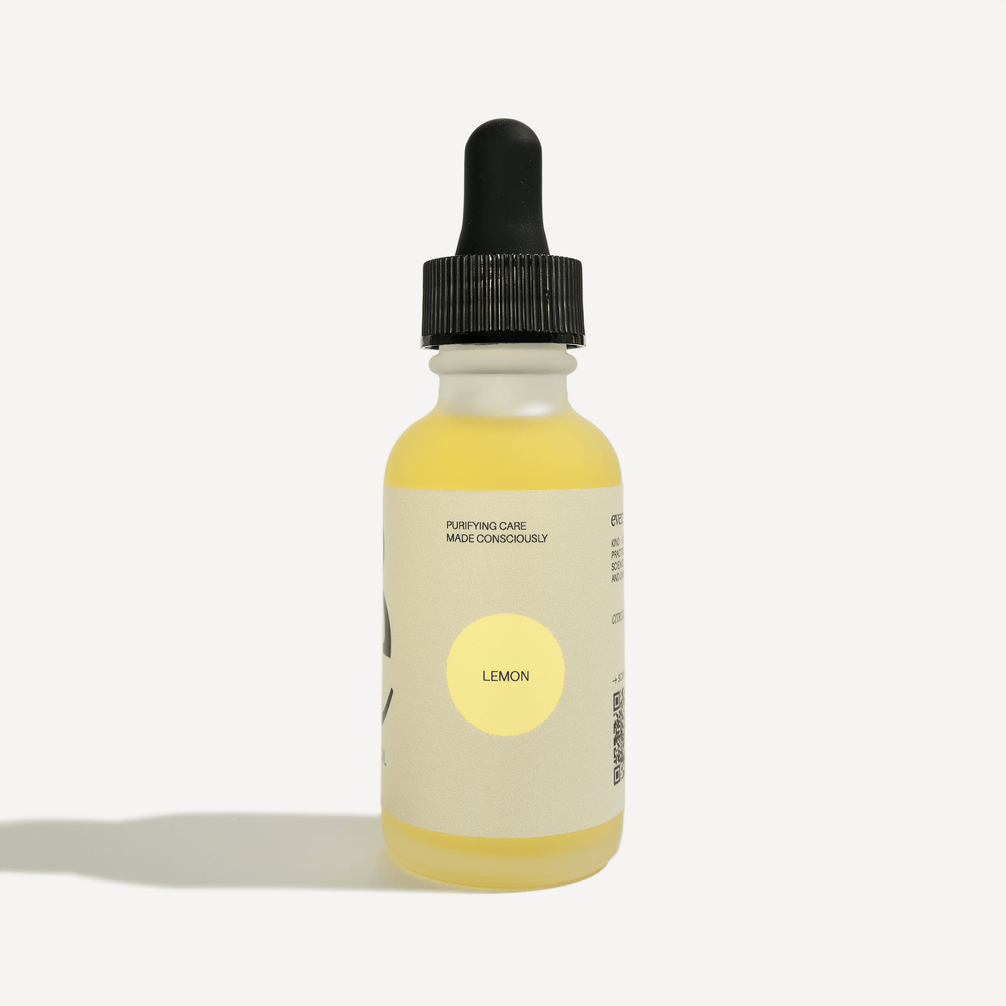 Lemon Essential Oil dropper bottle with purifying care label, showcasing natural cleaning benefits and refreshing aroma.