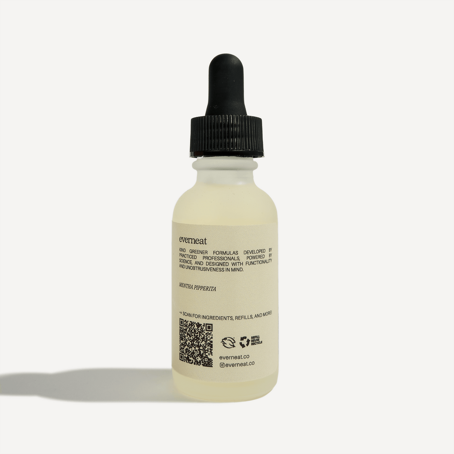 Peppermint essential oil bottle with dropper, showcasing plant-based, vegan, and cruelty-free attributes.