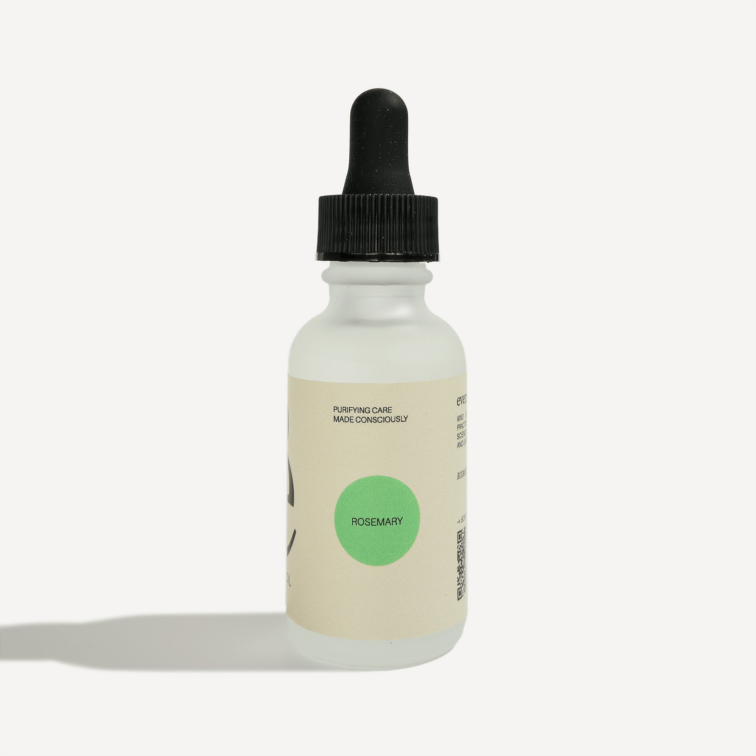 Rosemary essential oil dropper bottle with clean labeling, featuring a green cap and a minimalist design.