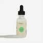 Rosemary essential oil dropper bottle with clean labeling, featuring a green cap and a minimalist design.