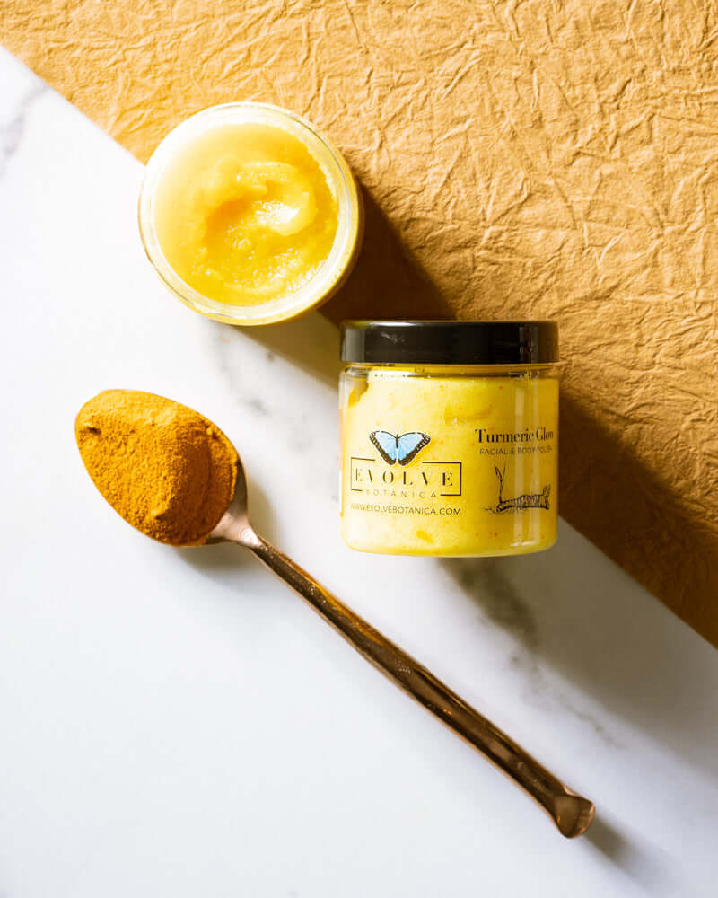 Turmeric Glow Facial Polish in jar with golden turmeric powder on a spoon, showcasing skincare product for glowing skin.