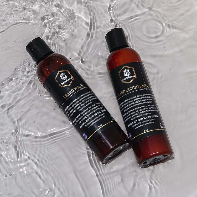 Beard wash and conditioner set in amber bottles, surrounded by water, ideal for a clean and soft beard.