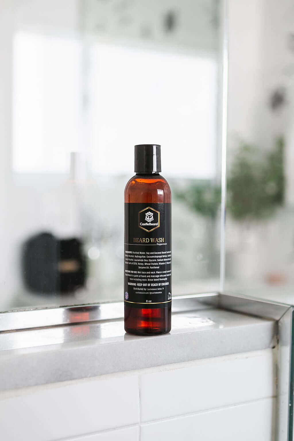 Beard wash bottle displayed in a modern bathroom setting, designed for cleaning and conditioning beards.