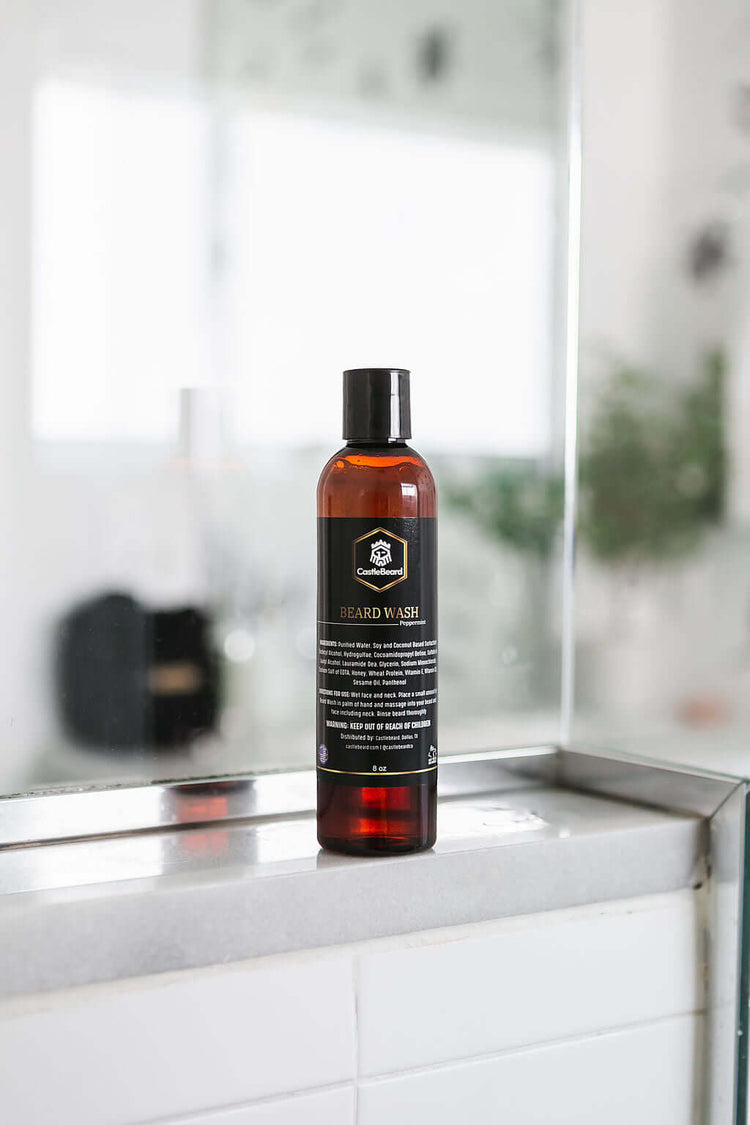 Beard wash bottle displayed in a modern bathroom setting, designed for cleaning and conditioning beards.