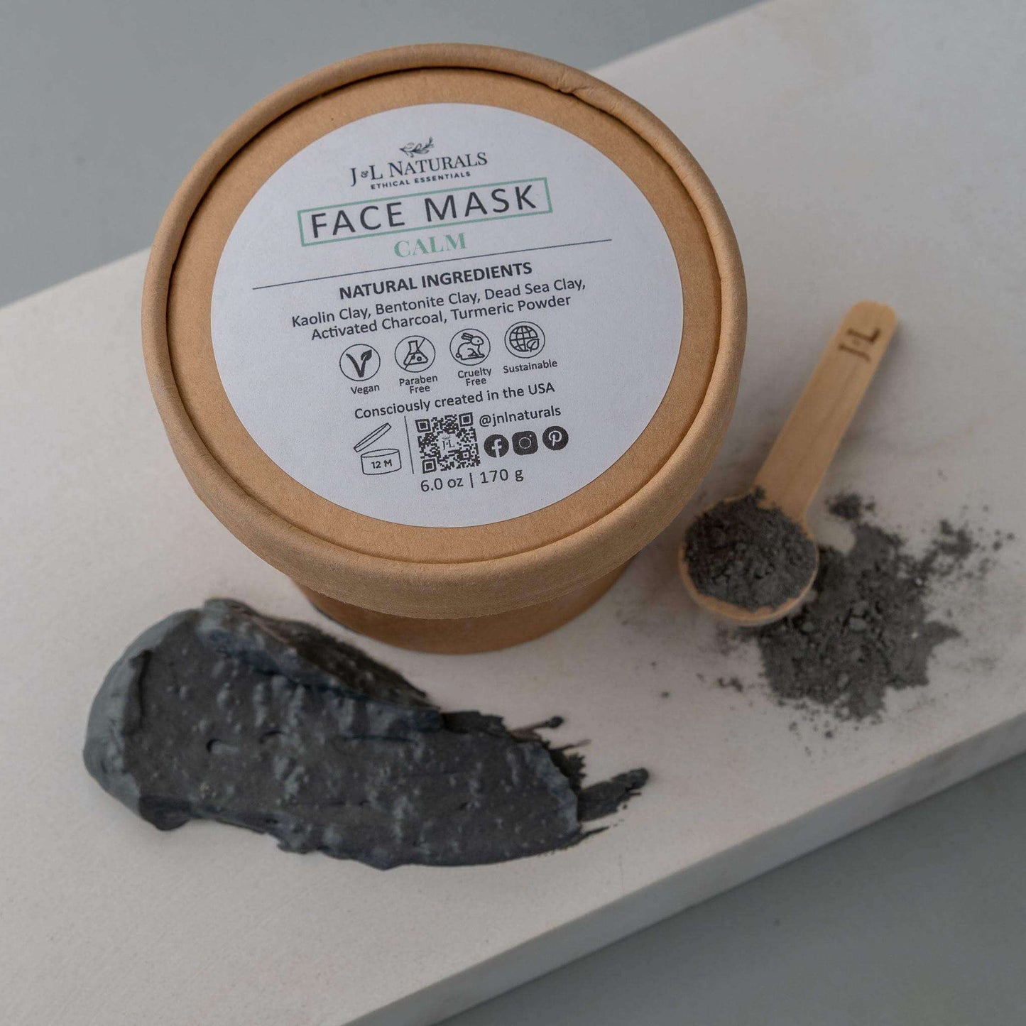 Calm face mask with natural ingredients on a wooden surface, promoting clear skin and relaxation.