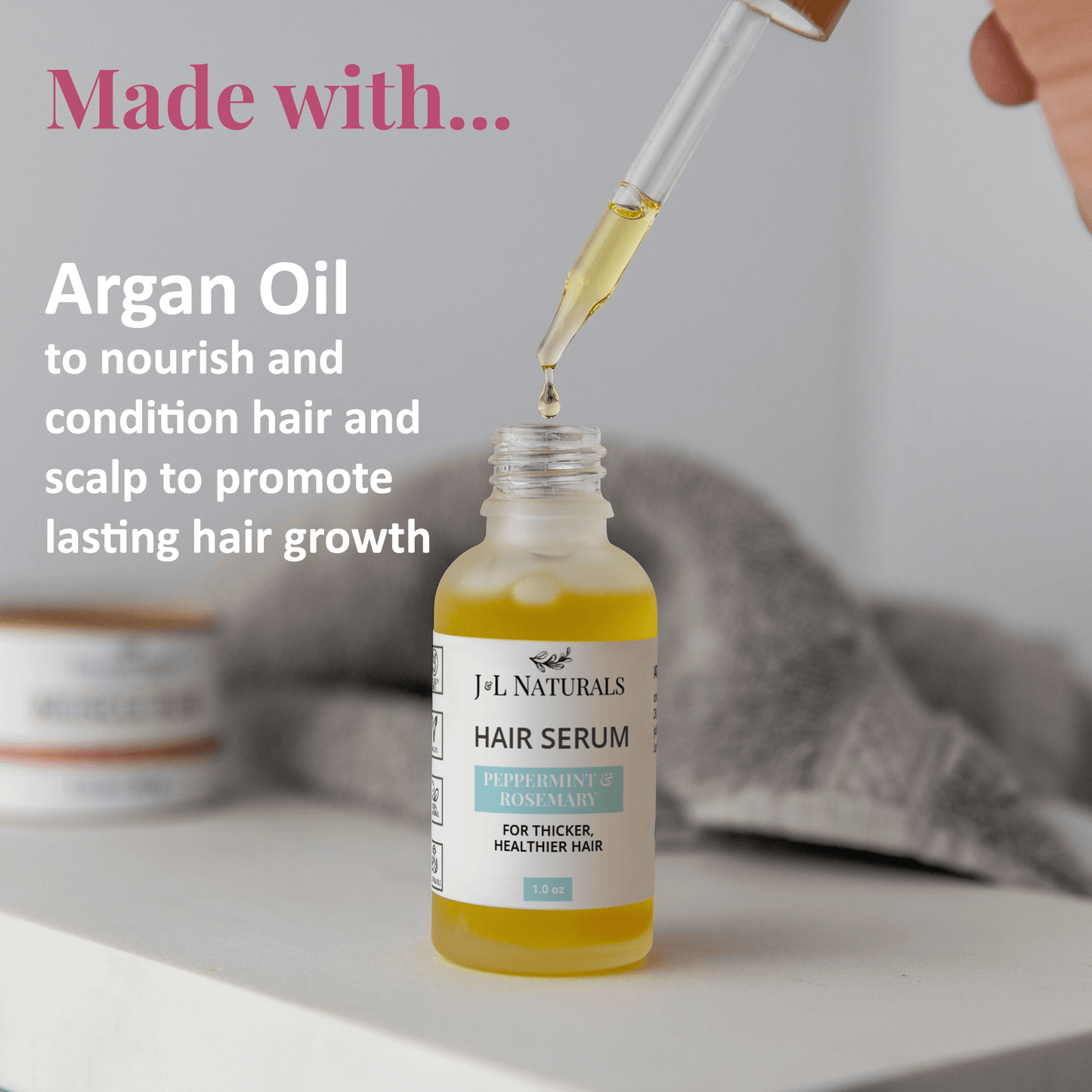 Hair serum bottle with argan oil for nourishing hair and scalp, promoting healthy growth and shine.