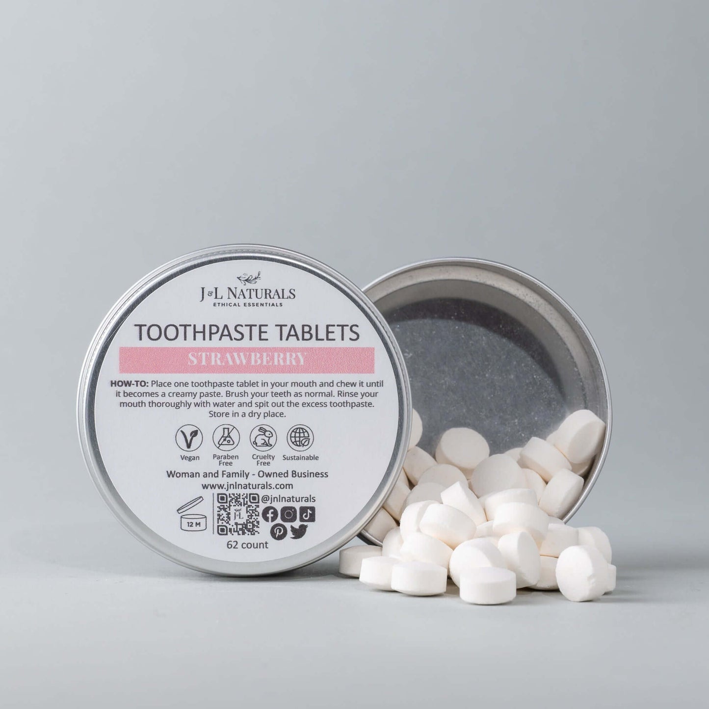 Eco-friendly toothpaste tablets in a tin, strawberry flavor, offering a sustainable dental hygiene alternative.