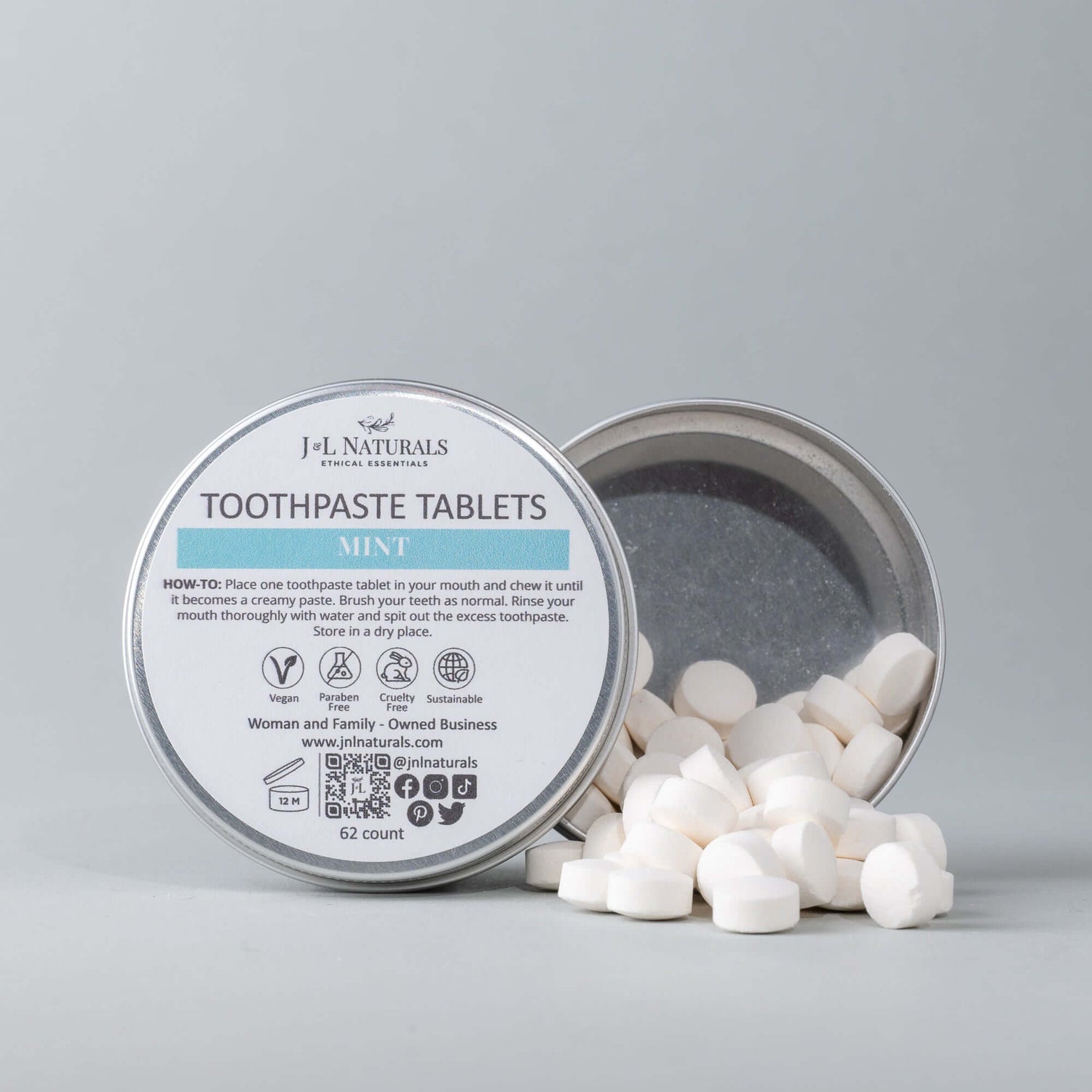 Eco-friendly toothpaste tablets in a tin with mint flavor, offering an easy and natural dental hygiene solution.