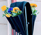 Cloth 6 pocket saddlebag hanging vertical garden planter with colorful flowers on a fence