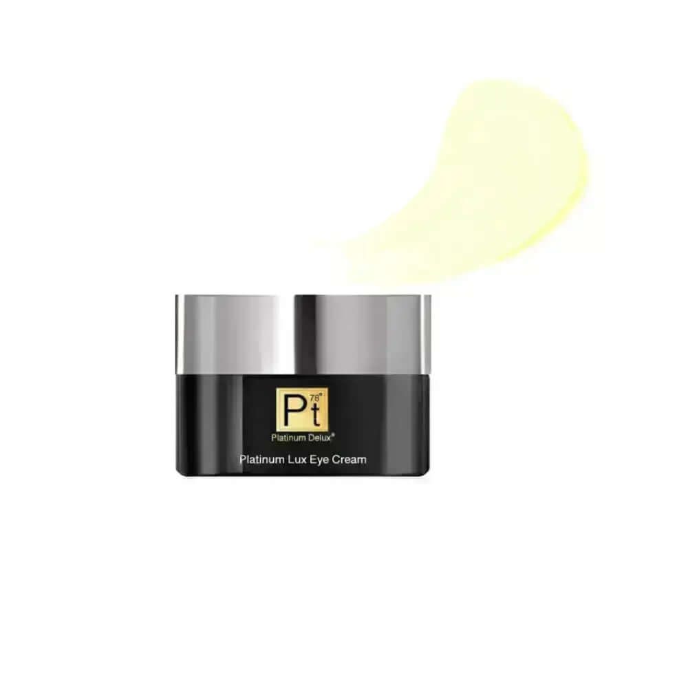 Platinum Lux Eye Cream in jar with yellow cream swatch, designed to rejuvenate tired under-eye skin.