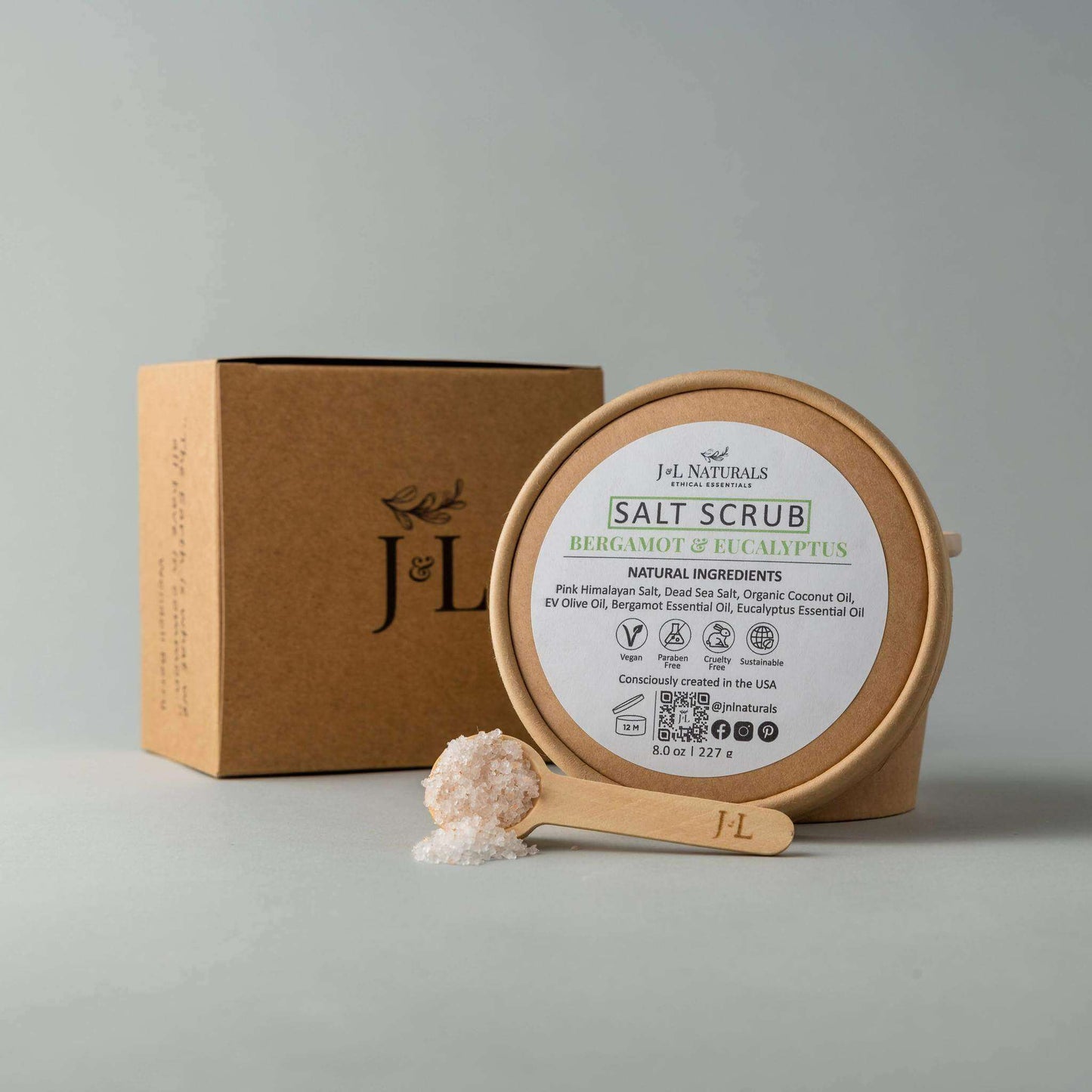 J&L Naturals Salt Scrub with Bergamot & Eucalyptus in eco-friendly packaging, promoting soft, moisturized skin.