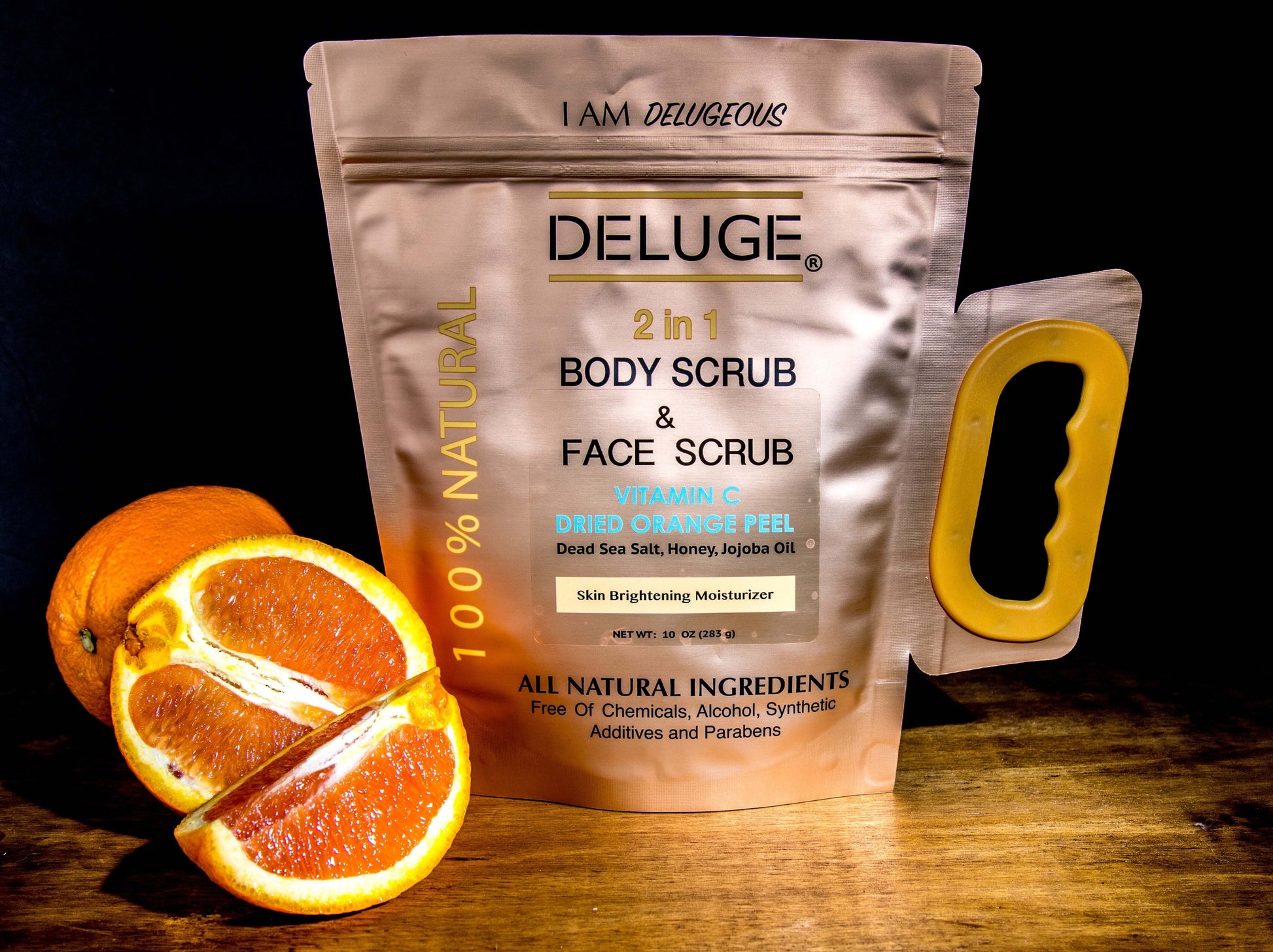 Deluge 2-in-1 Vitamin C body and face scrub with dried orange peel, honey, and Dead Sea salt, showcasing natural ingredients.