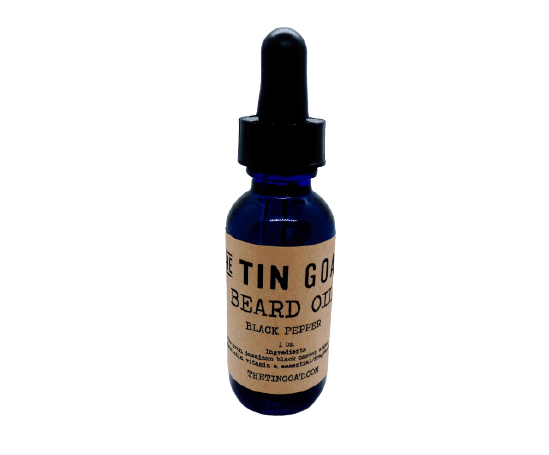 Beard oil bottle with black pepper scent, featuring a luxurious blend of essential oils and carrier oils.