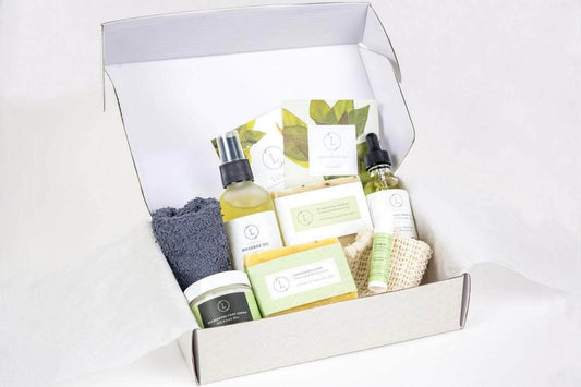 Men's natural skincare set in a gift box, featuring grooming products, soaps, and a washcloth with eucalyptus scent.