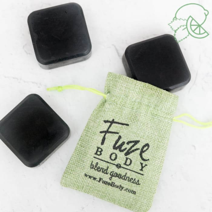 Mojito Activated Charcoal Facial Soap bars with eco-friendly sachet from Fuze Body, featuring skin-nourishing ingredients.