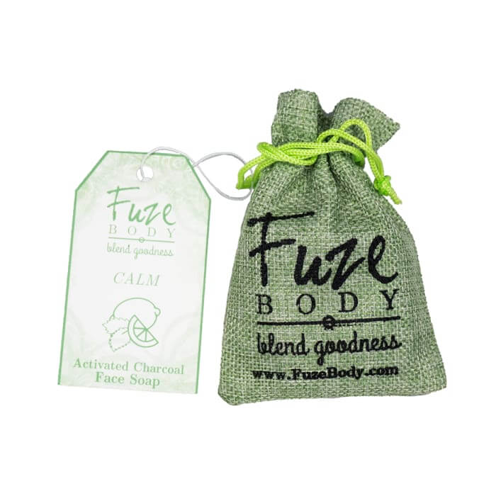 Eco-friendly packaging for Fuze Body Activated Charcoal Facial Soap with calming properties and essential oils.