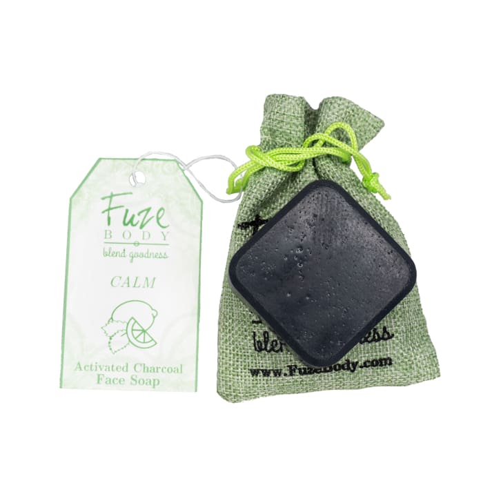 Mojito Activated Charcoal Facial Soap in eco-friendly bag with tag, featuring activated charcoal, goat milk, and essential oils.