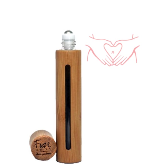 Wood roll-on bottle for women's essential oils, featuring a heart design and natural bamboo casing.