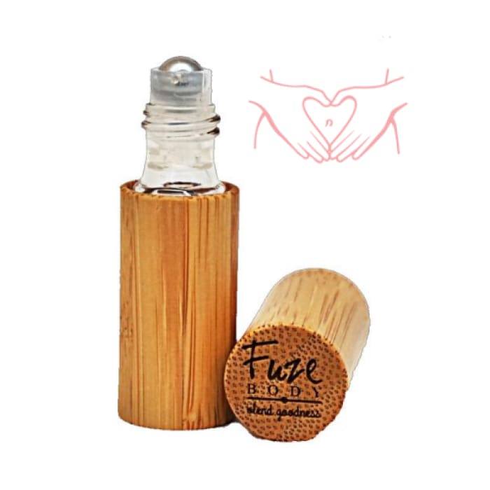 Women’s Monthly Comfort roll-on bottle with bamboo casing for essential oils, designed for soothing cramp relief.