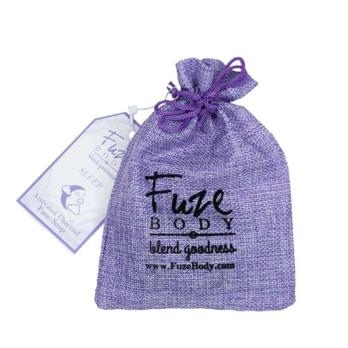 Purple sachet containing Sleep Activated Charcoal Facial Soap, promoting skin health and purity with essential oils.