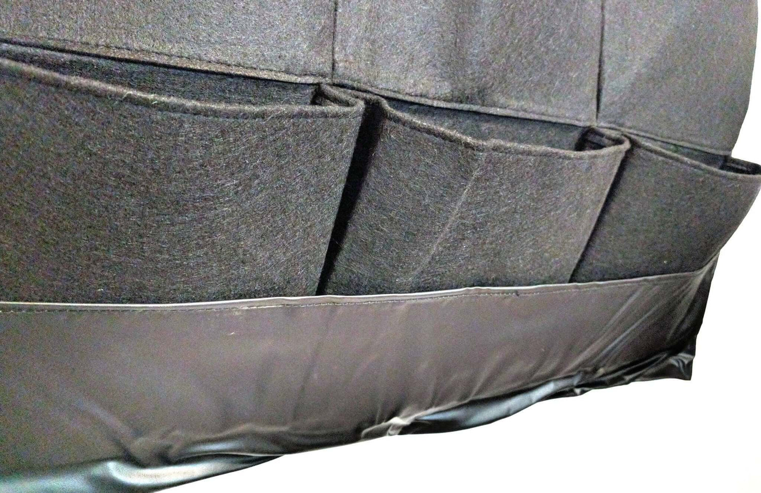 Close-up of the waterproof vertical living wall planter with multiple pockets for planting herbs and flowers.