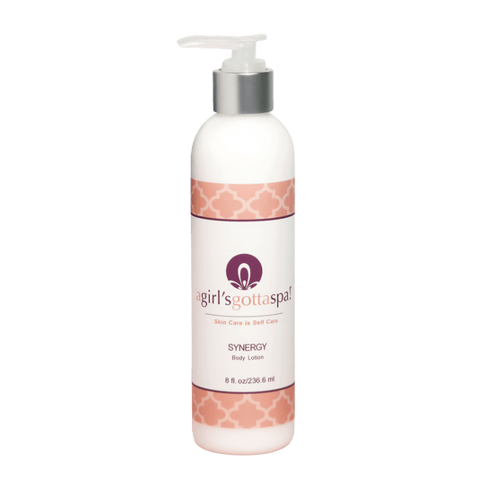 Synergy Body Lotion in a pump bottle, enriched with lavender and shea butter for moisturizing dry skin.