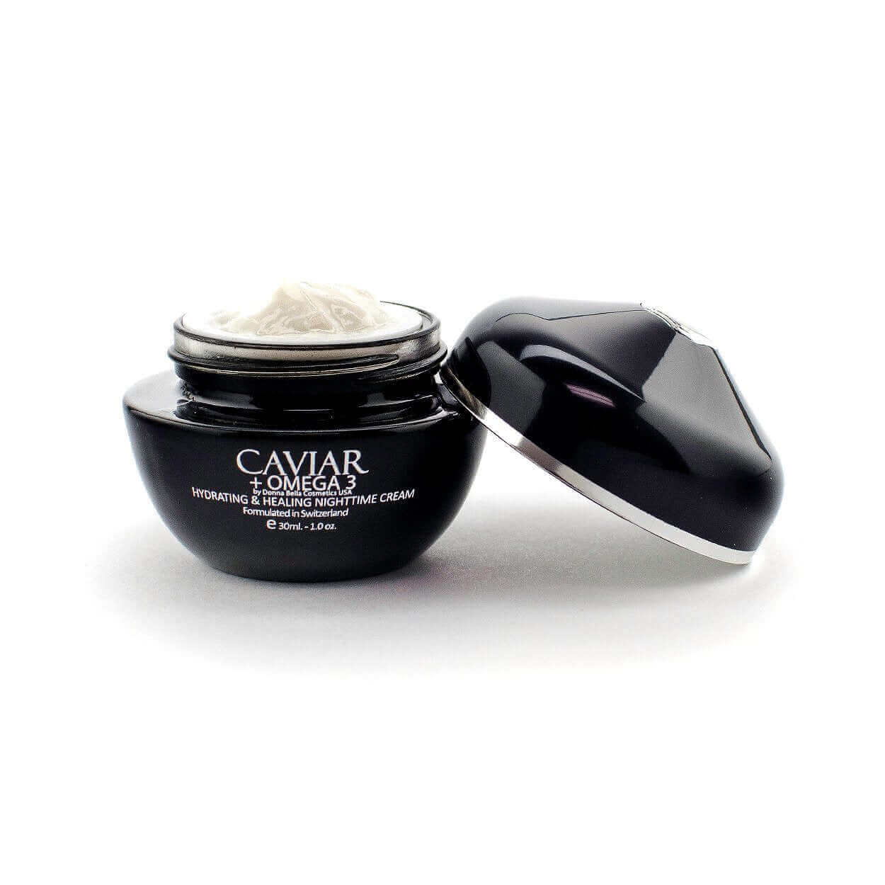 Donna Bella's Caviar + Omega 3 Hydrating & Healing Nighttime Cream in a sleek black jar.