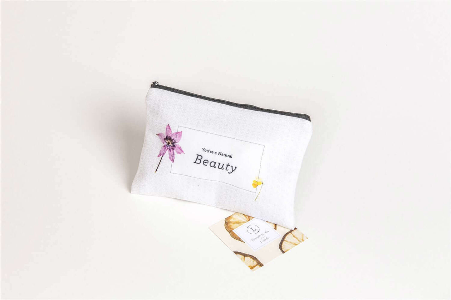 Handmade cosmetic bag with floral design and 'You're a Beautiful' label, ideal for spa gift boxes.