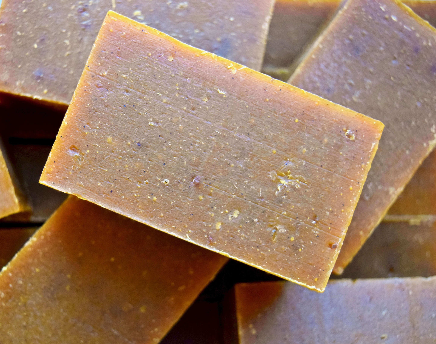 Pumpkin Spice Body Bar with hints of ginger, cinnamon, and crushed pumpkin seeds, perfect for exfoliating and nourishing skin.