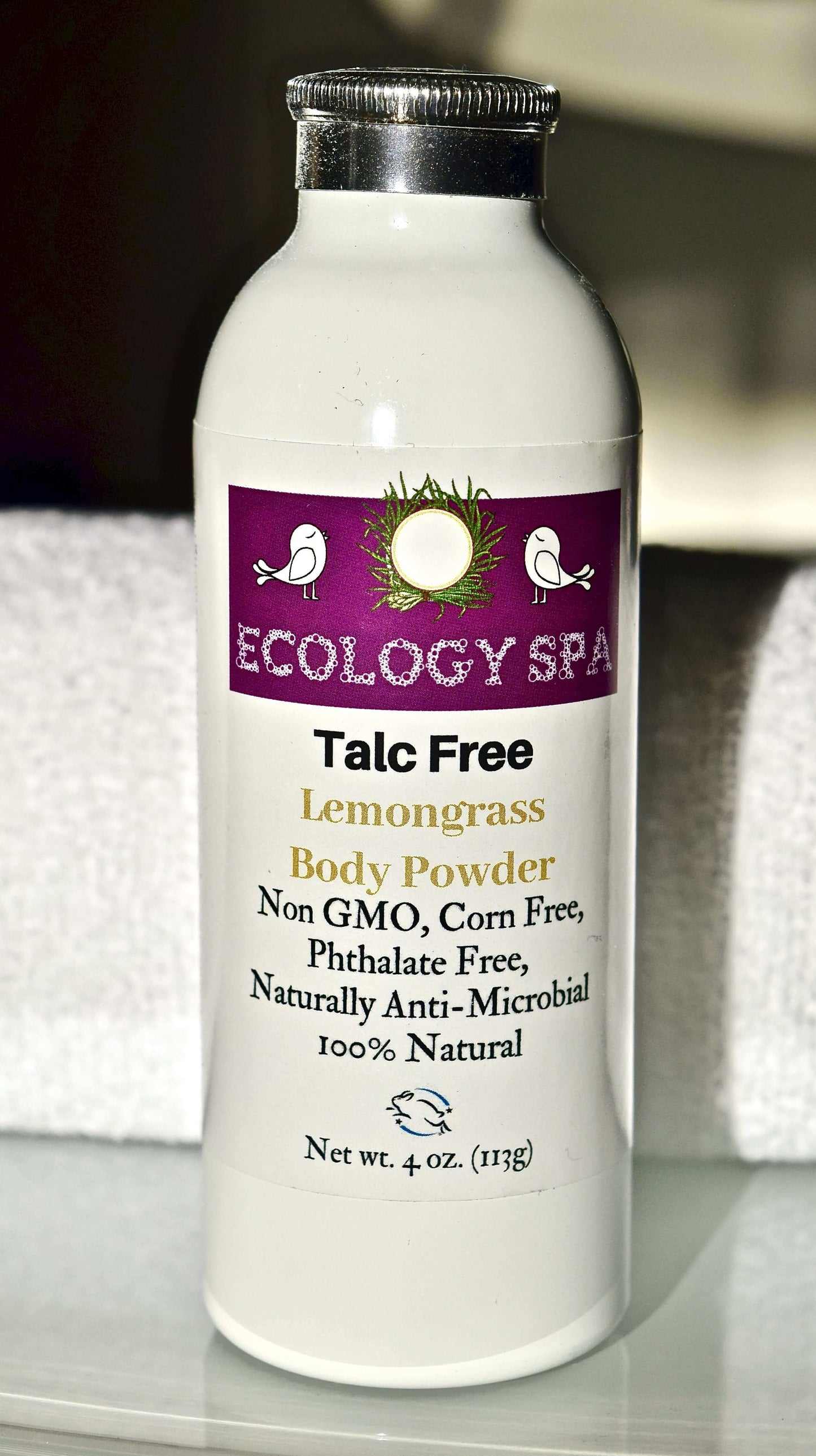 Eco-friendly talc-free lemongrass body powder by Ecology Spa in a 4 oz bottle.