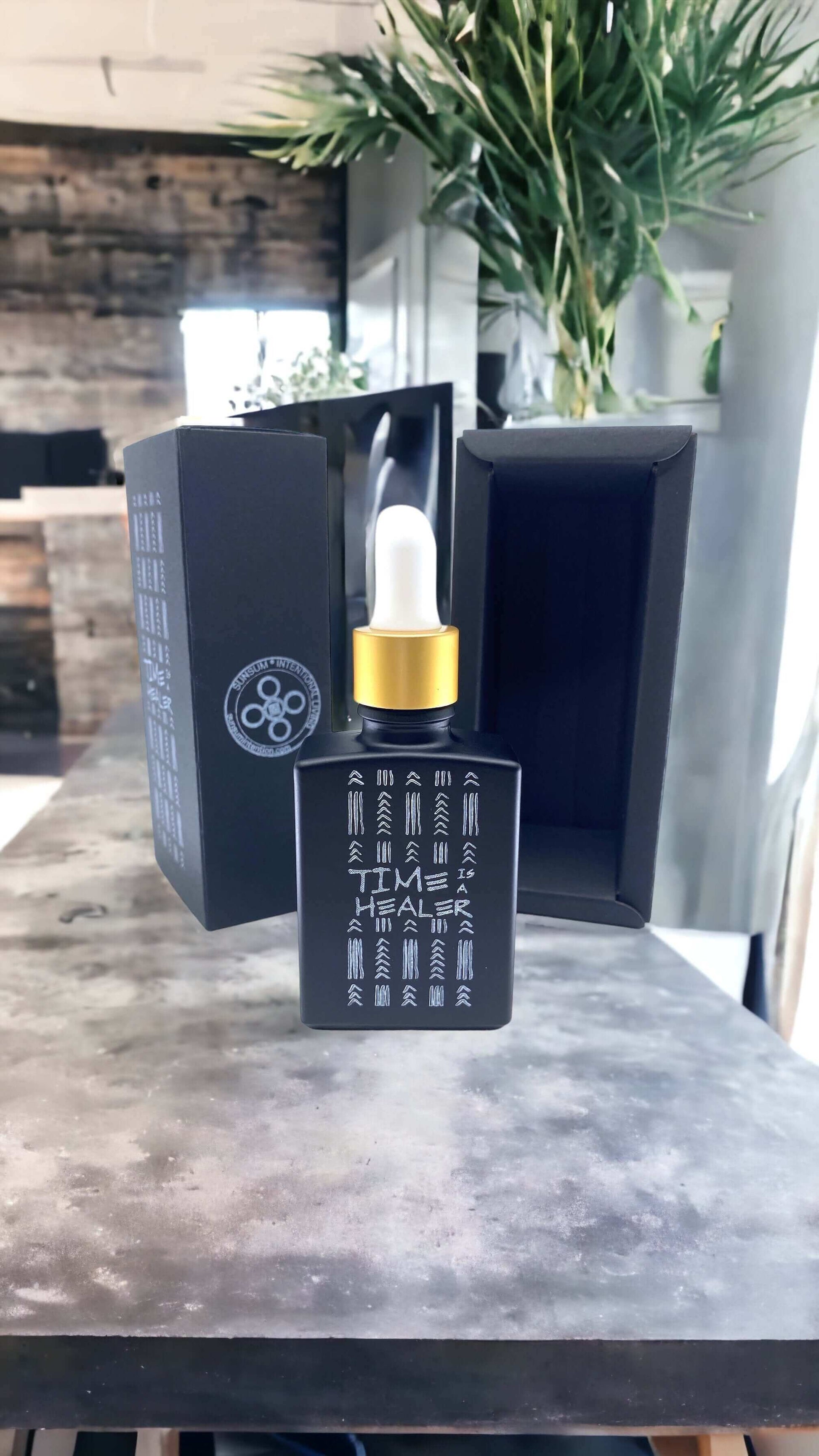 Time Is a Healer personal fragrance bottle and box displayed on a modern countertop, showcasing elegant design.