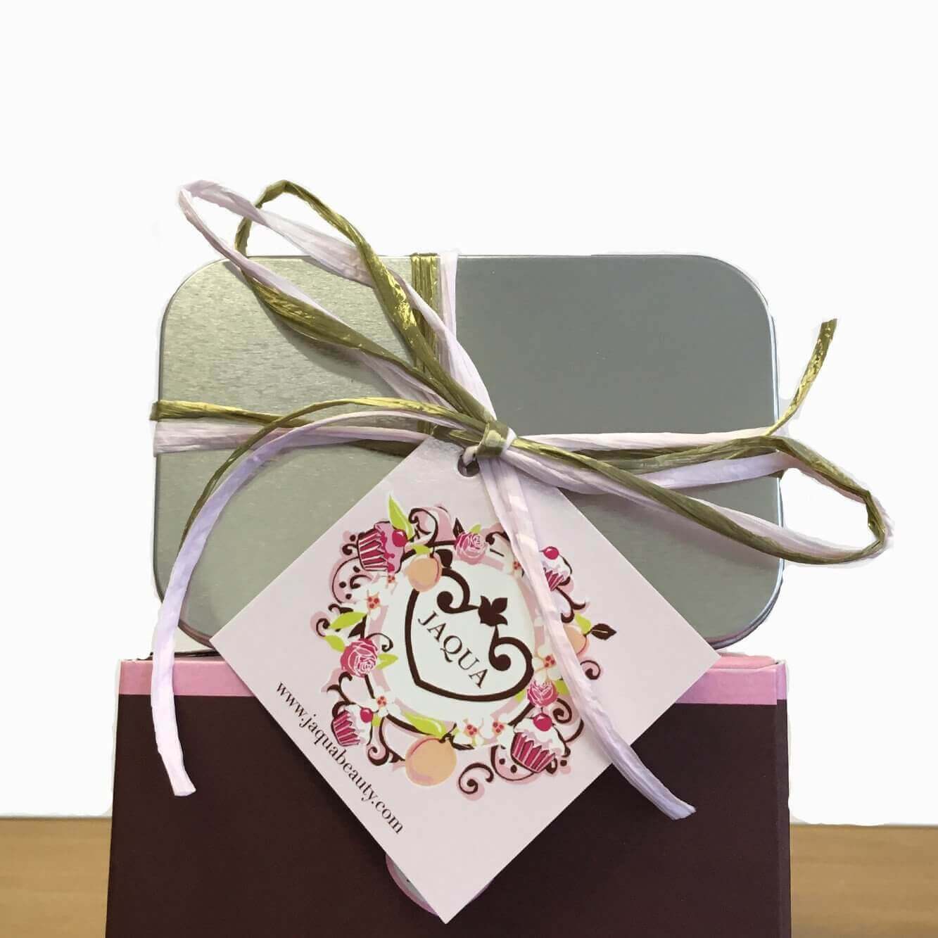 Jaqua gift box elegantly wrapped with a ribbon, showcasing the Raspberry Buttercream Frosting fragrance collection.