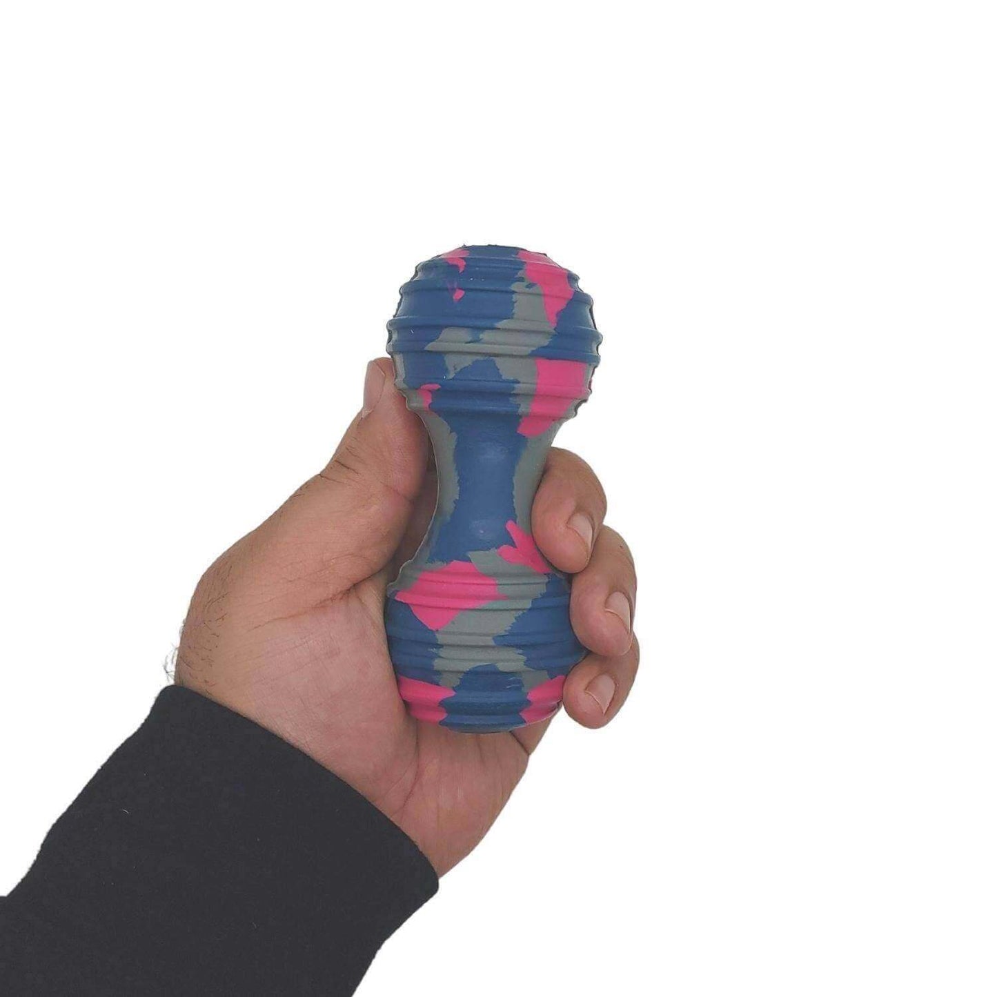 Natural rubber dumbbell dog toy in hand, colorful camo pattern for sustainable pet fun and mental stimulation.