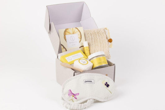 Natural Citrus Bath & Body Skincare Set in a gift box with soap, facial mask, lip balm, and eye mask.