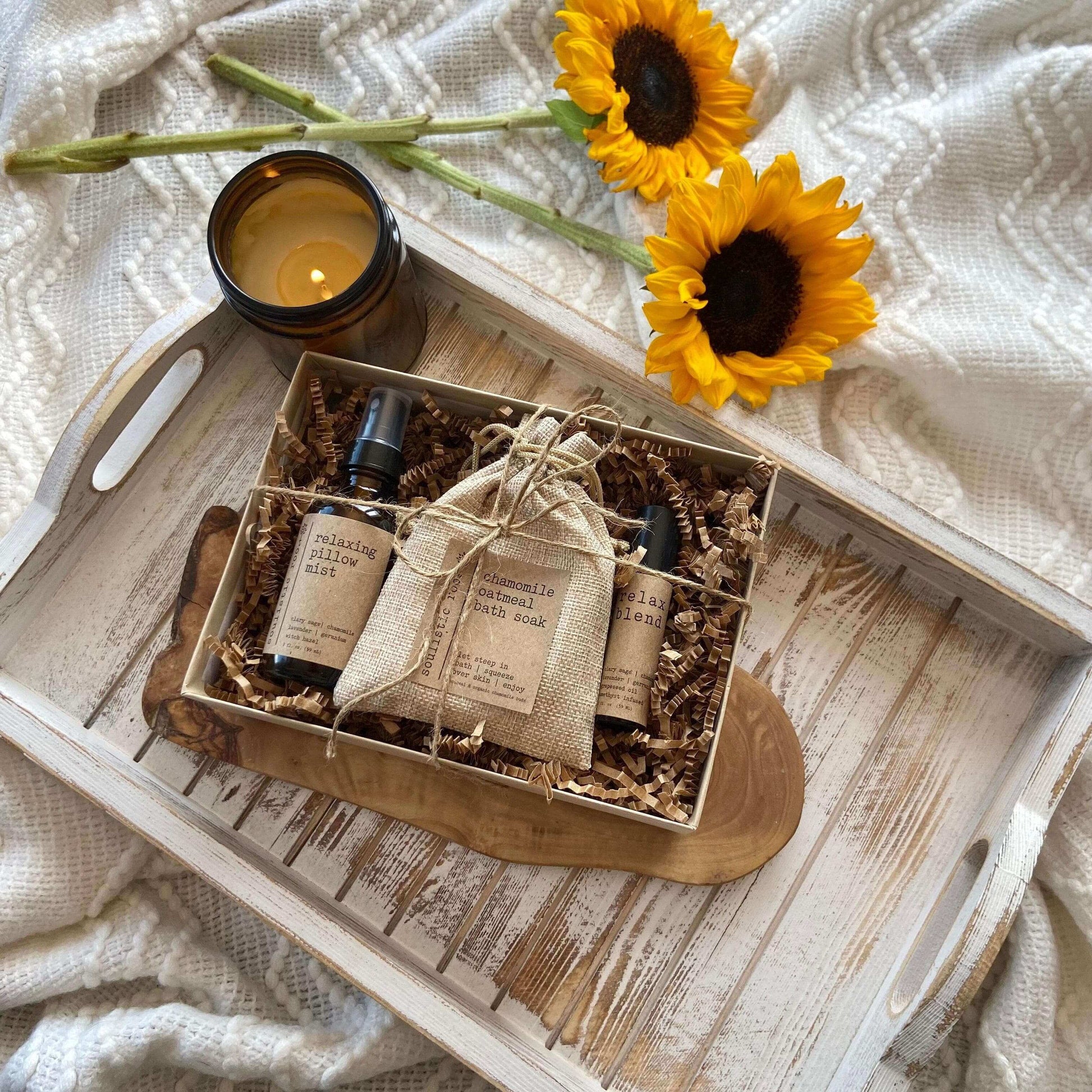 Relax Gift Set | Trio featuring pillow mist and chamomile oatmeal soak in a wooden tray with sunflowers.