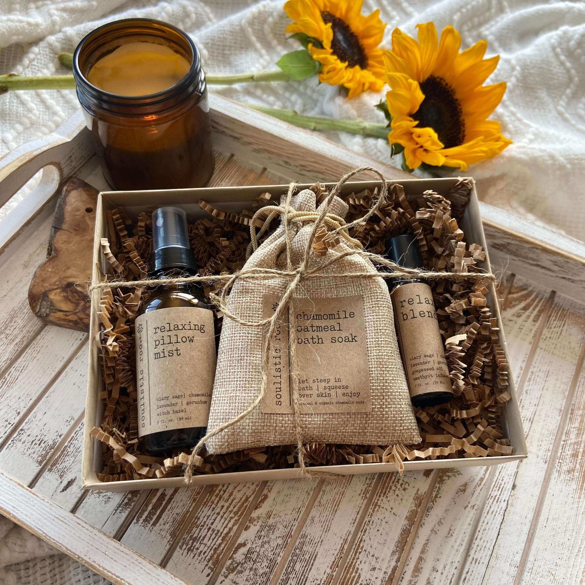 Relax Gift Set featuring relaxing pillow mist and chamomile oatmeal soak in a gift box with sunflowers.